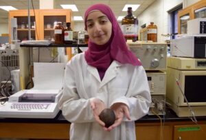 Mona Hamdy holding an avocado for future testing — Laboratory for Environmental Analysis