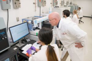 Staff scientist Tom Maddox works with students using new instruments for stable isotope analysis in the UGA Center for Applied Isotope Studies.